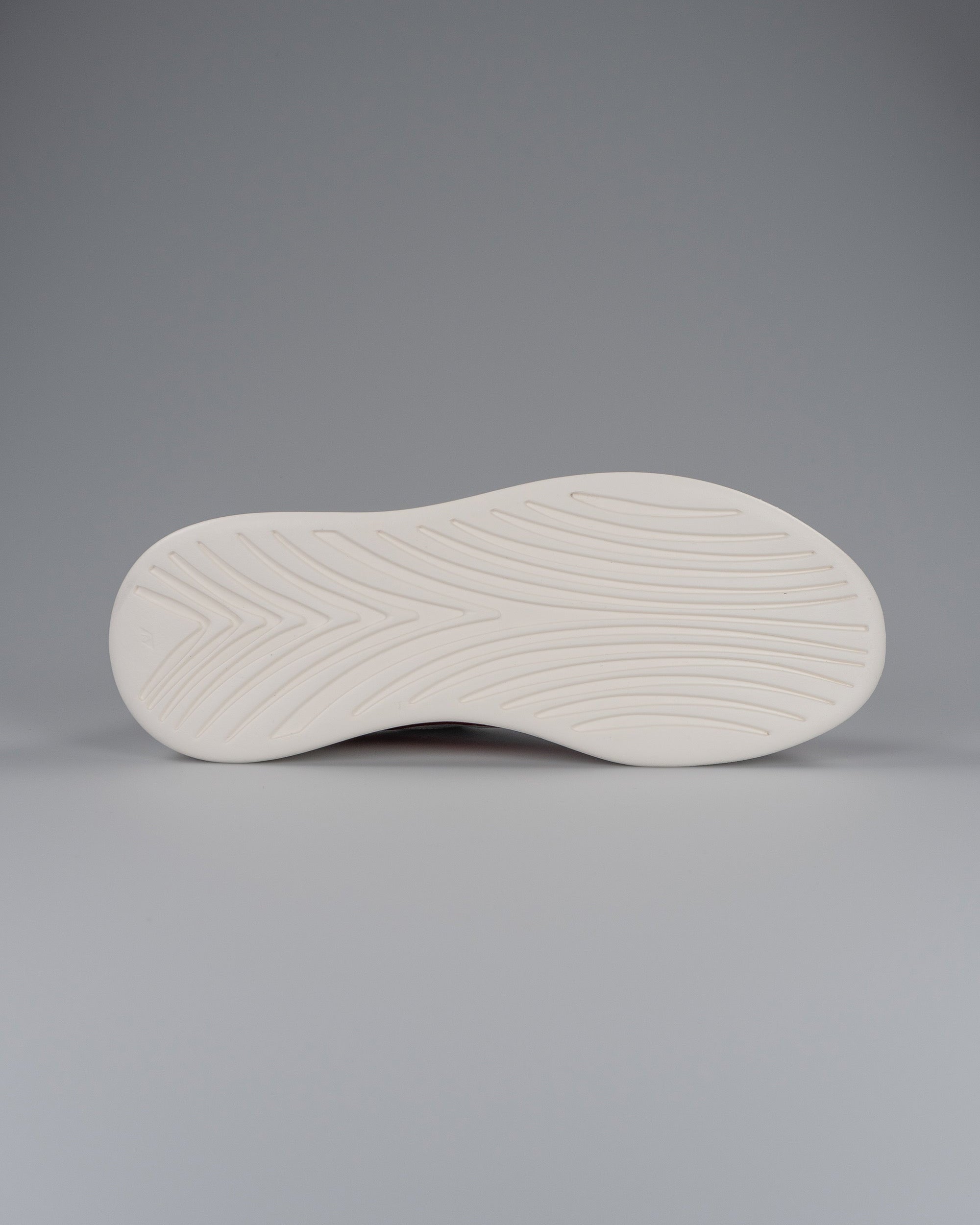 White shoe sole on a gray background